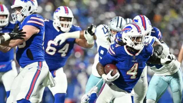 Buffalo Bills running back James Cook rushes for a gain against the Dallas Cowboys.